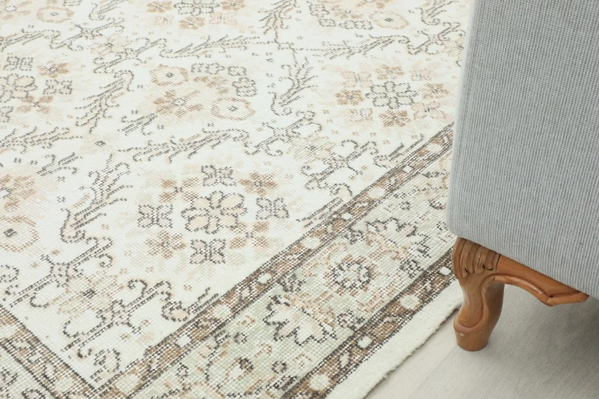 Rug shown next to a furniture leg, illustrating its scale and how it fits into decor