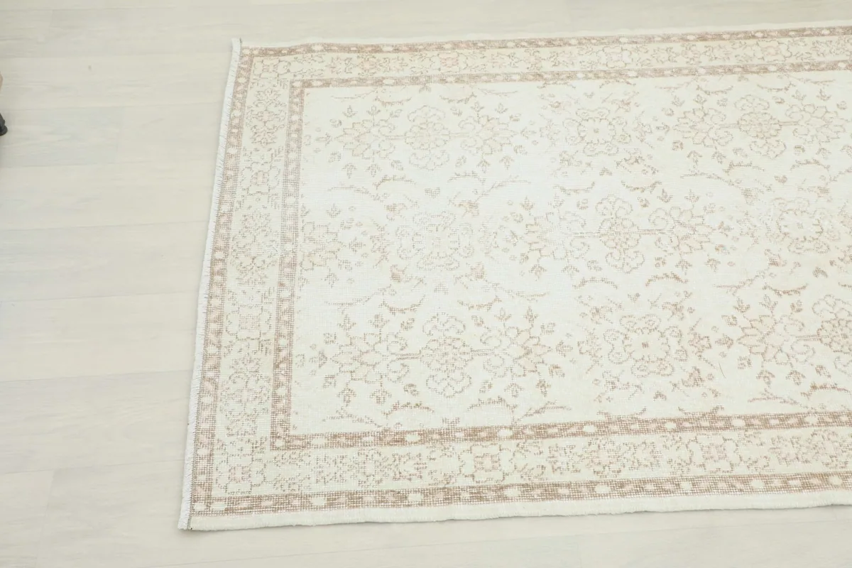 Another corner view of the vintage Anatolian rug, highlighting the subtle floral motifs