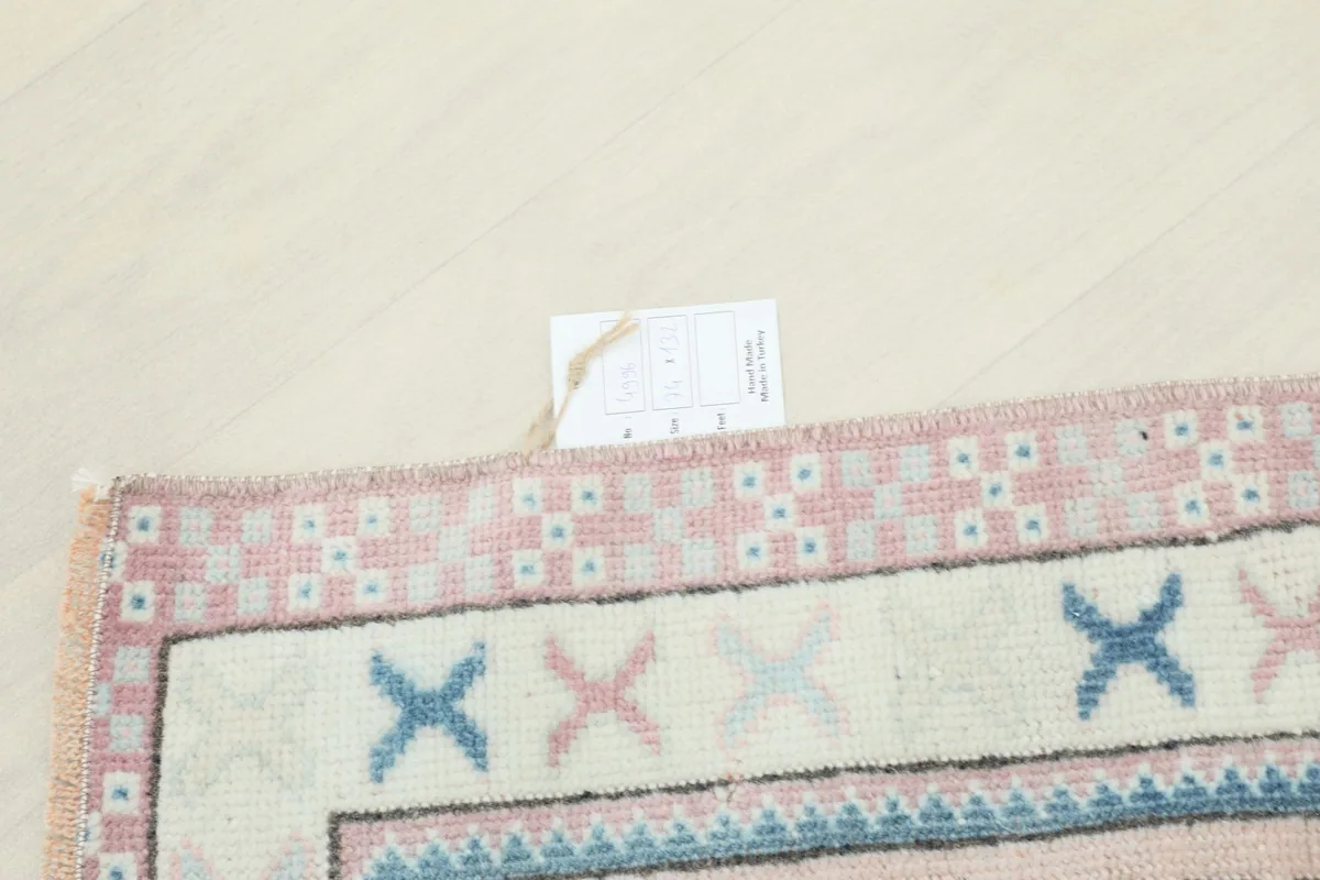 Rug corner with a label, indicating the product details and origin