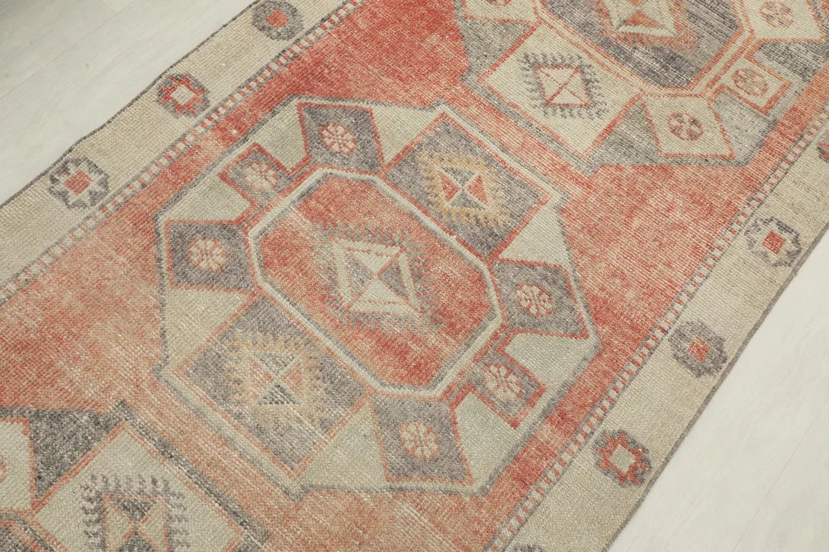 Detailed view of the central geometric medallions and color variations