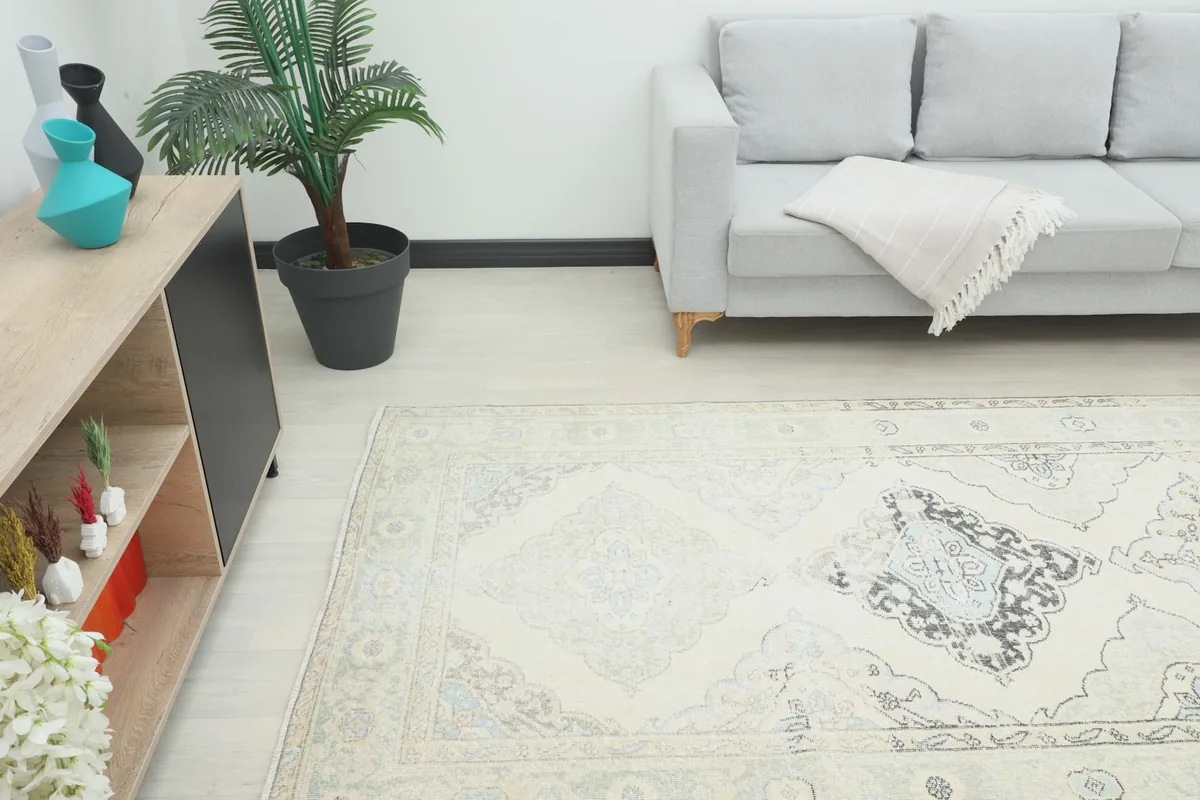 Runner rug extending from a living room seating area, highlighting its suitability for narrow spaces.
