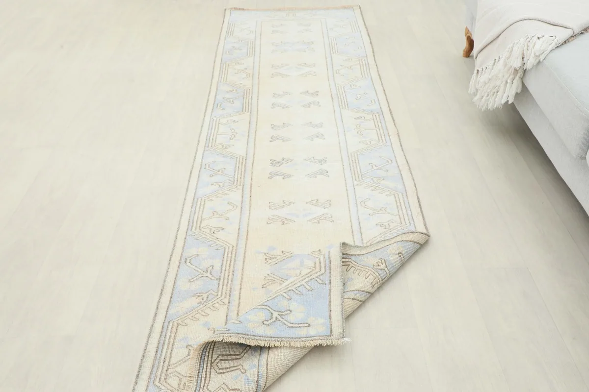 View of the runner partially unrolled in a room, demonstrating its length and placement