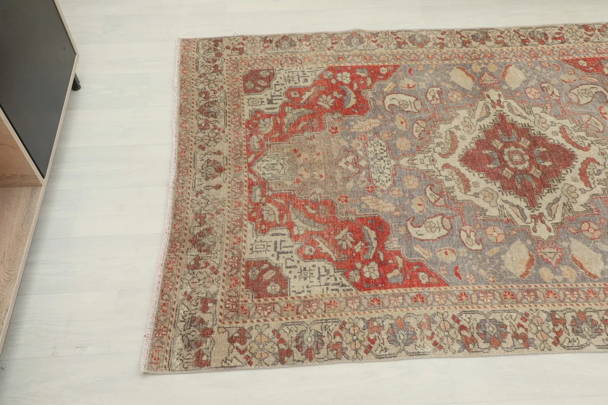 Overhead angle view of the rug, capturing the central medallion and surrounding patterns.