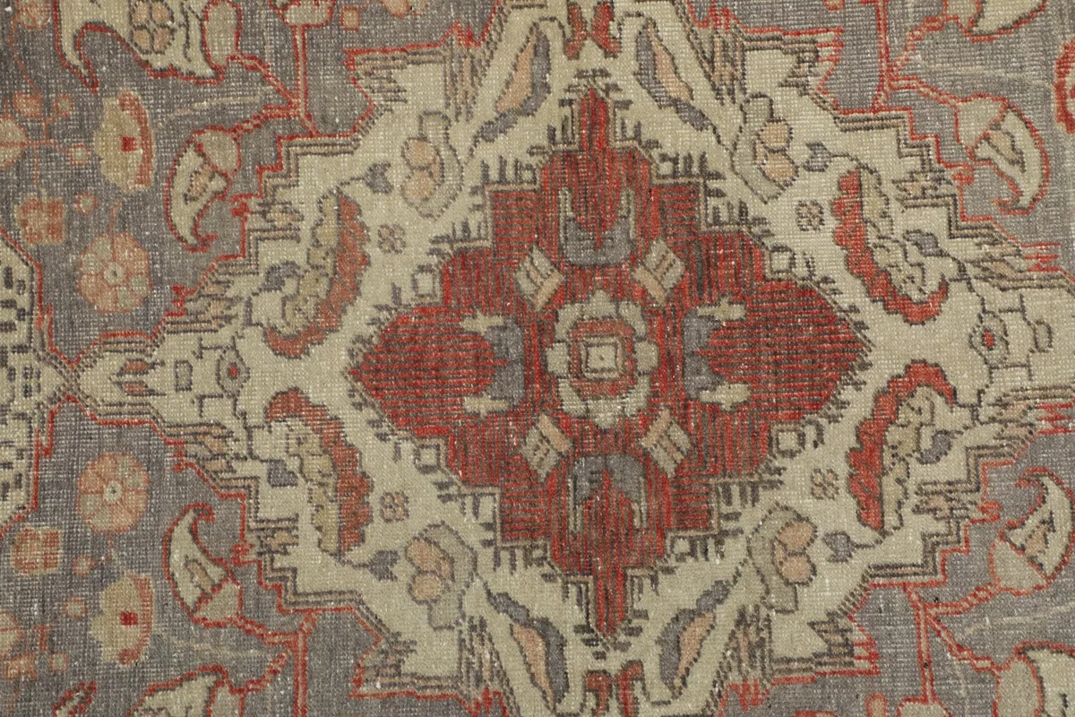 Extreme close-up of the central medallion, showing individual knots and color variations.