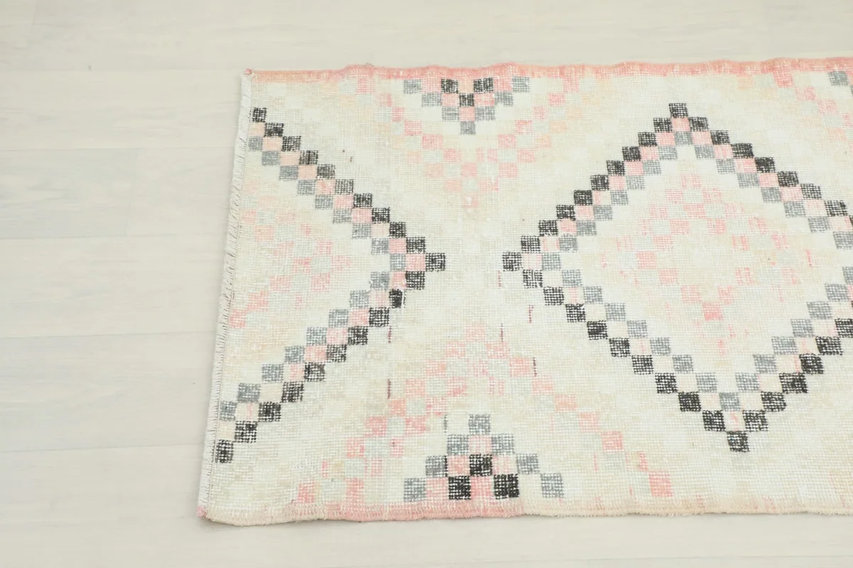 Close-up of the other end of the runner, displaying the hand-knotted texture and design.
