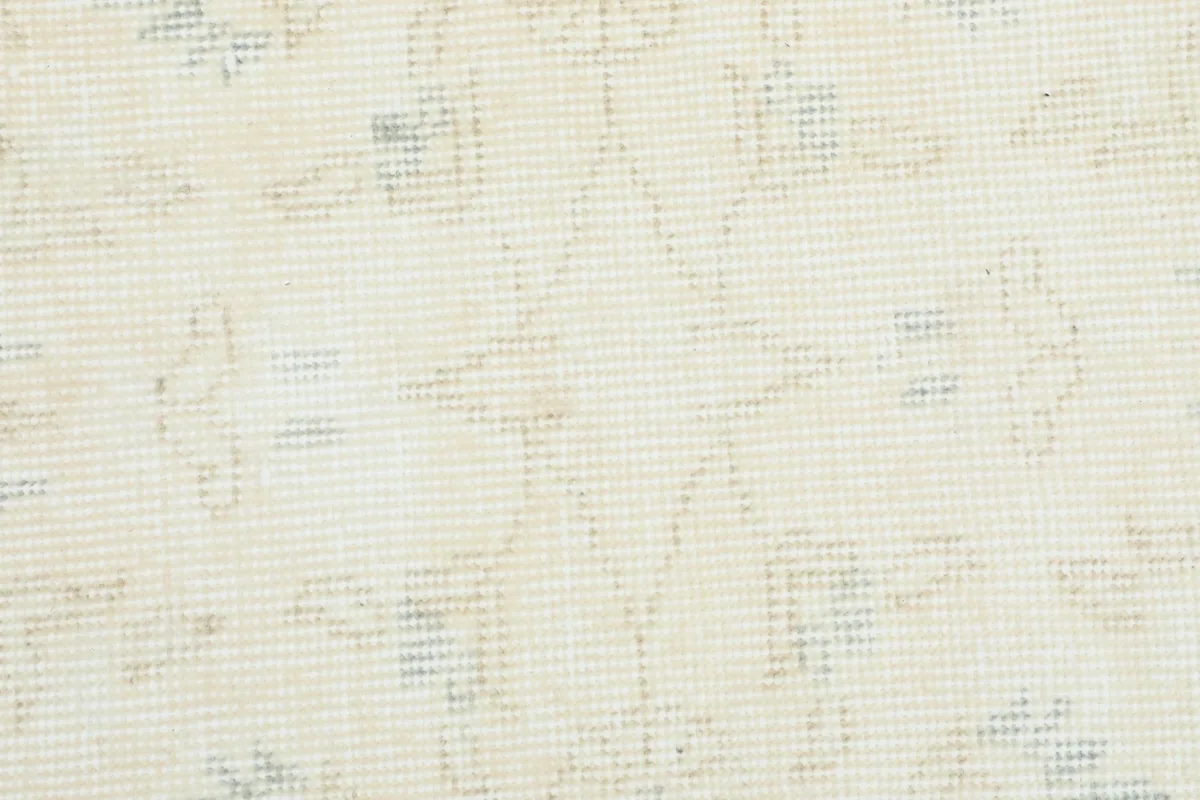 Close-up showing the low pile texture and the intricacy of the hand-knotted wool on cotton foundation.