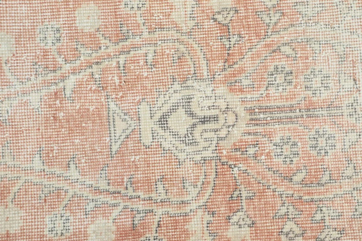 Close-up of the hand-knotted wool pile and intricate motif details