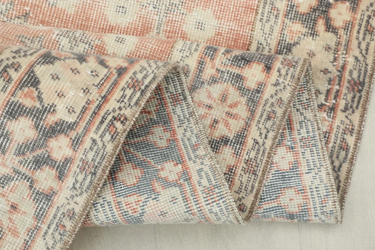 Close-up of the rug's reverse side, showing the hand-knotted construction