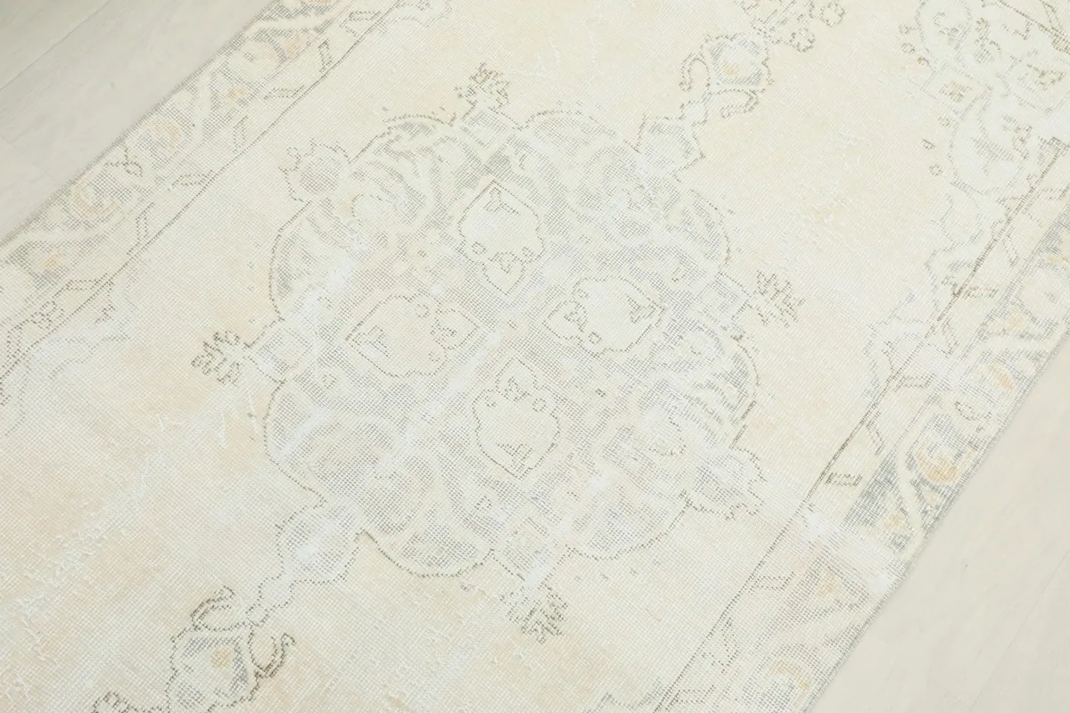 Overhead detail of the central medallion design and surrounding floral patterns