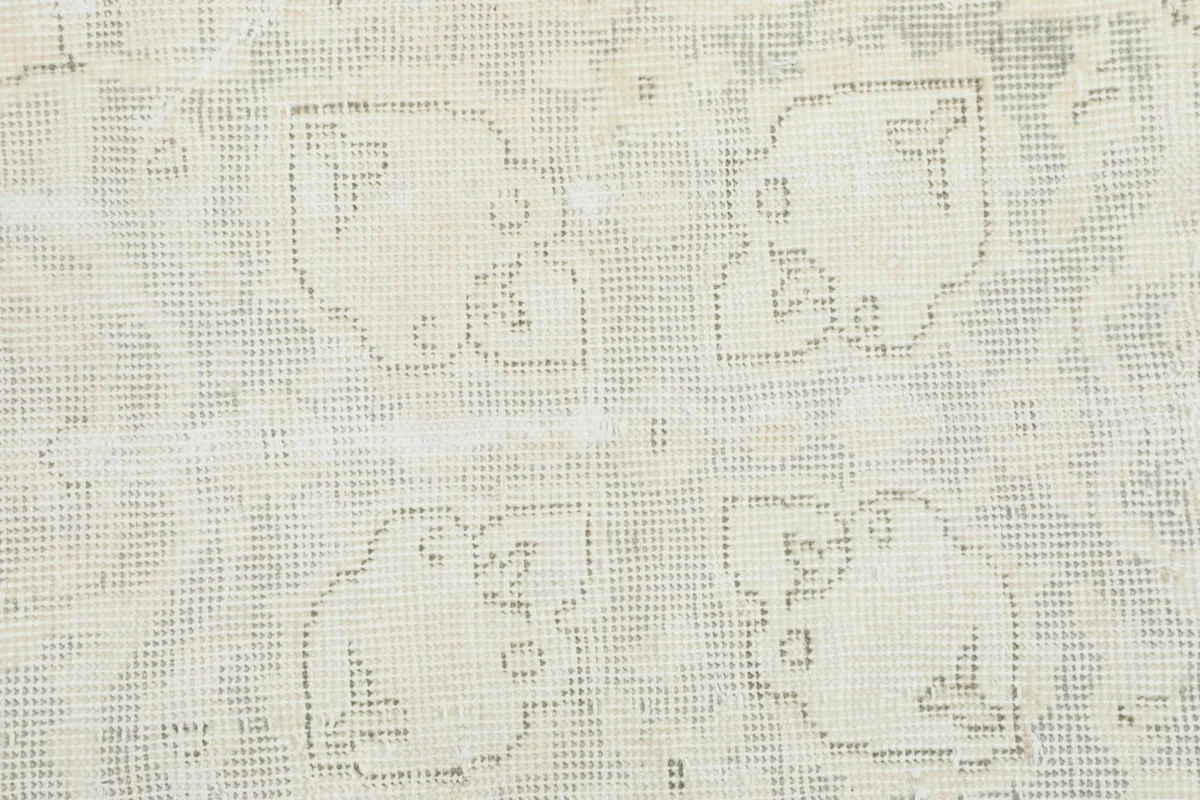 Close-up view of the low wool pile and the hand-knotted texture of the rug