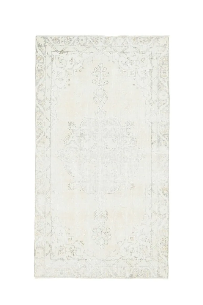 Full overhead shot of the vintage Anatolian rug on a white background
