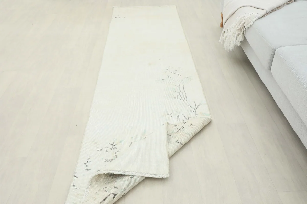 Angled view of the runner partially rolled, highlighting its texture and length