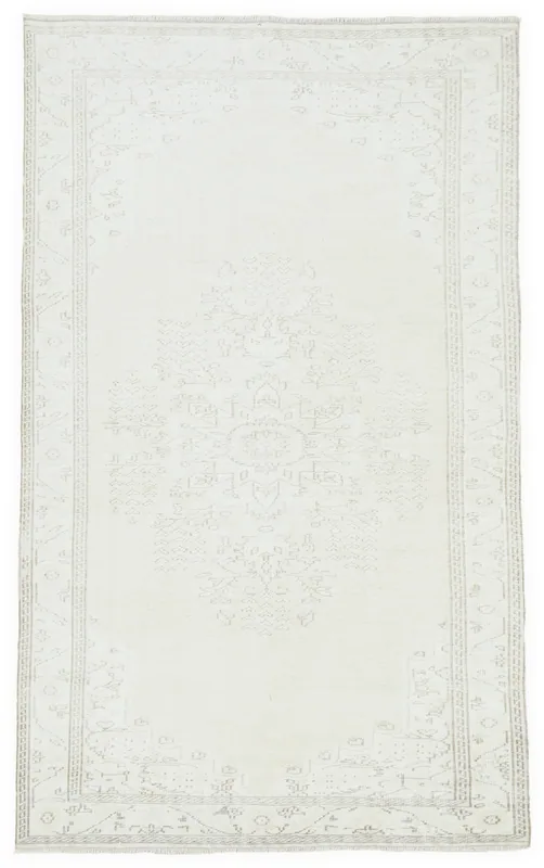 Full top view of the 5'7" x 9'6" ivory vintage Anatolian rug on a white background.