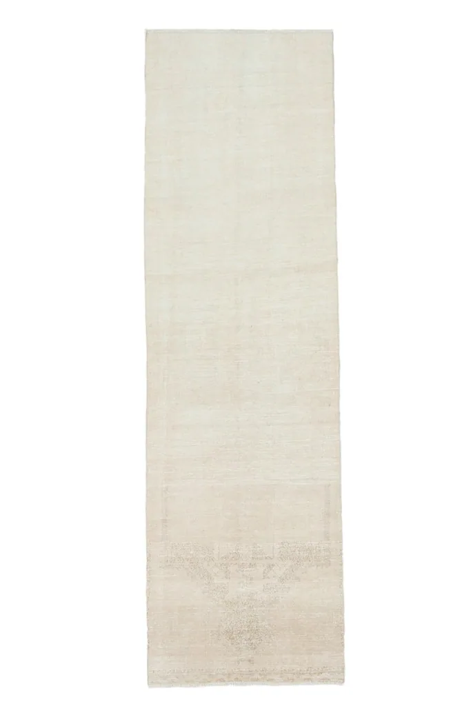 Another full overhead view of the 2'11" x 10'4" vintage ivory and beige runner rug