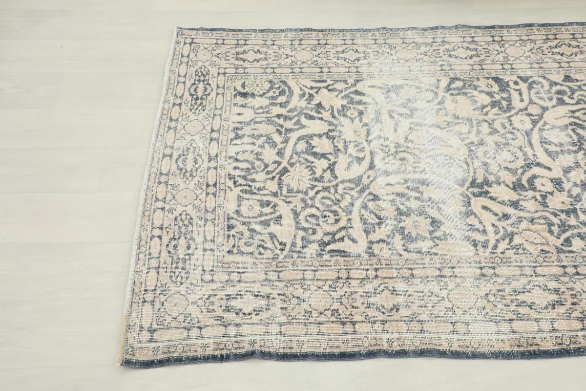 Another close-up angle of the rug, showing the blend of charcoal and beige tones