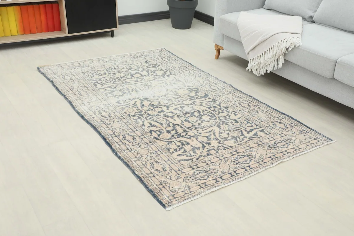 Overhead angle of the rug in a living room, showing its placement relative to furniture