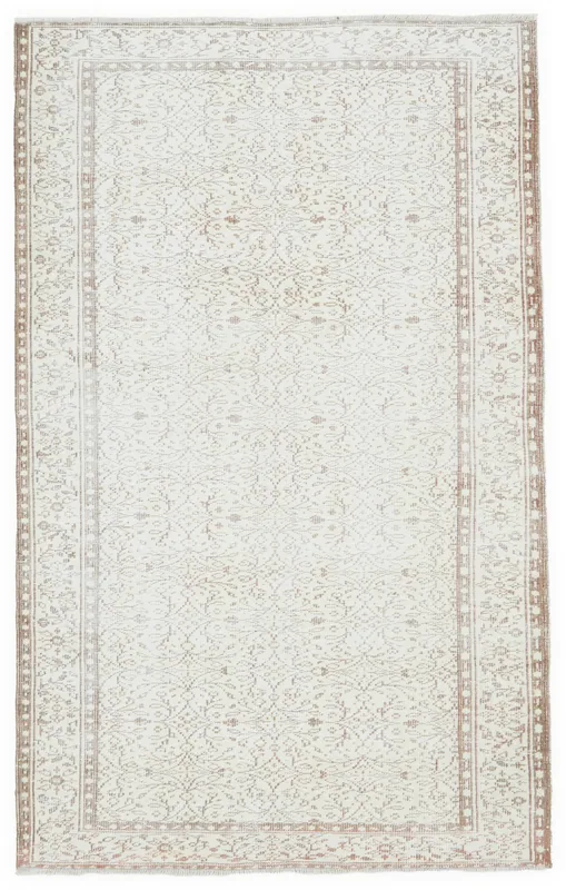 Full overhead view of the 5x8 vintage Anatolian rug with cream field and tan patterns
