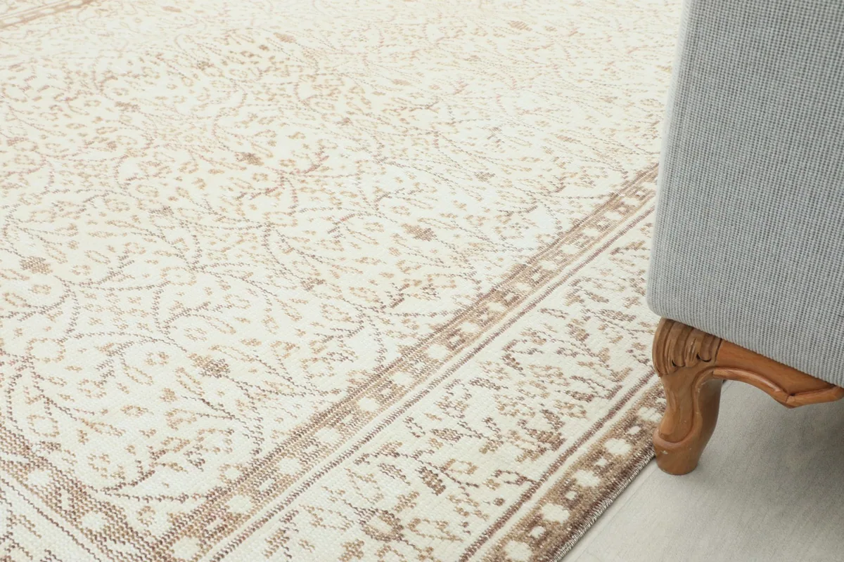 Rug placed under a sofa leg, showing its integration into a home decor setting