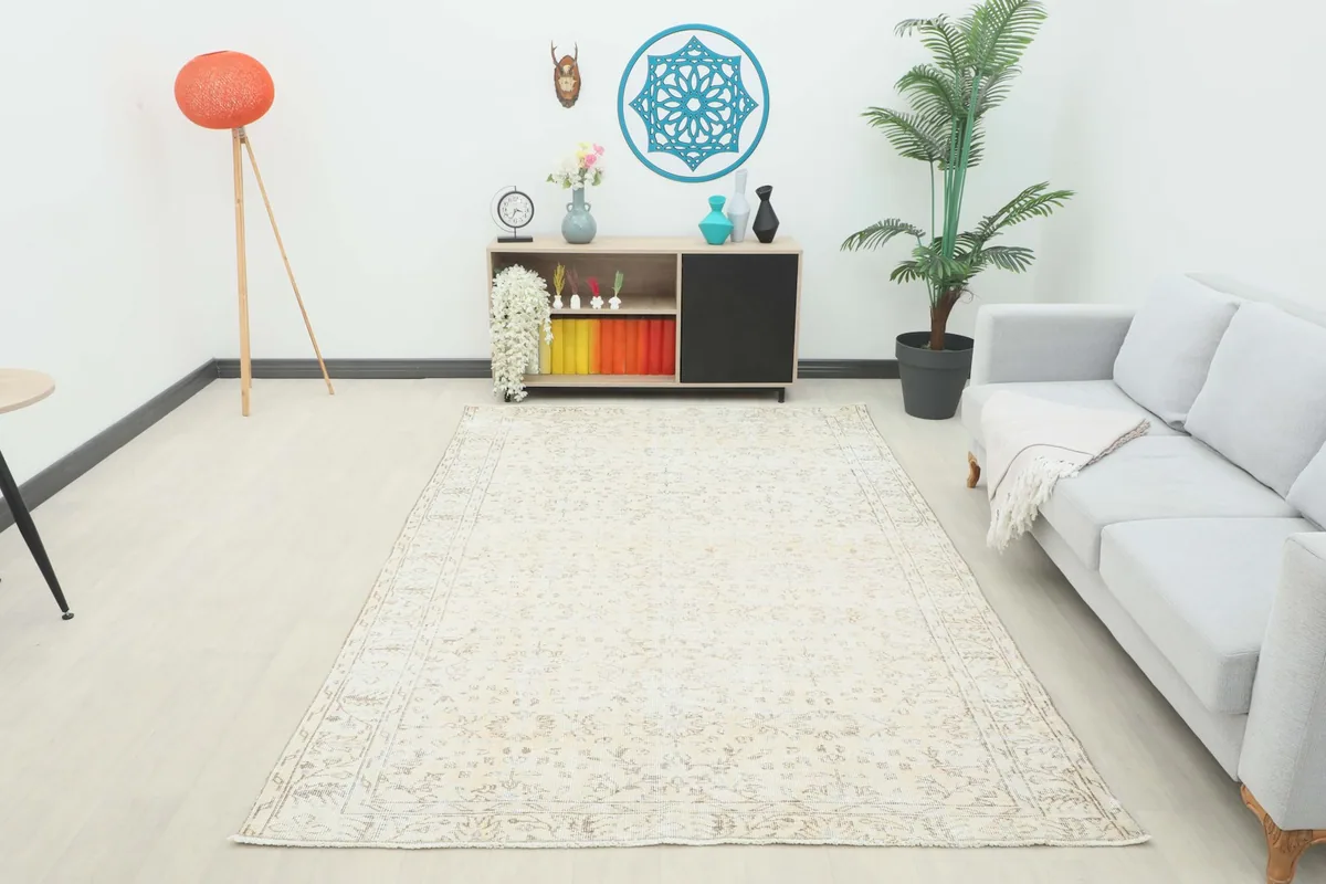 Full view of the rug laid out in a bright, minimalist living room