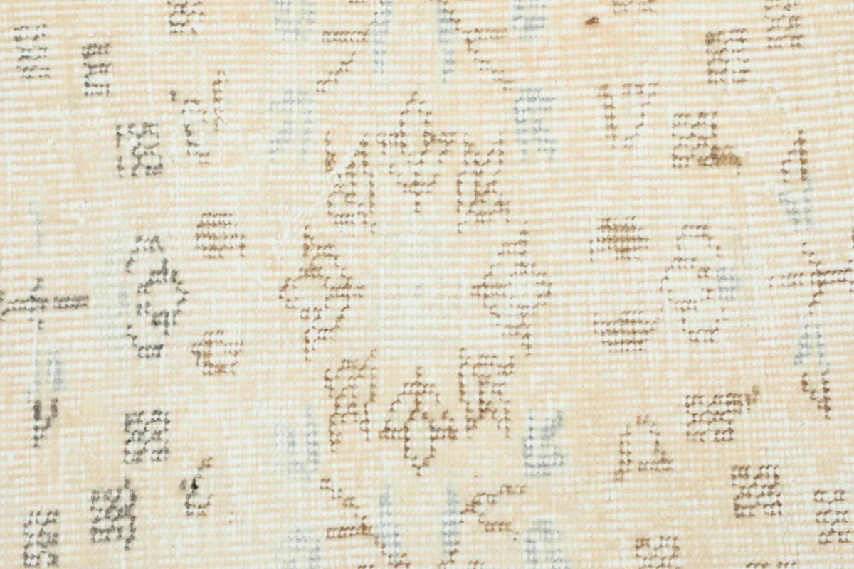 Detailed view of the central medallion pattern and faded colors