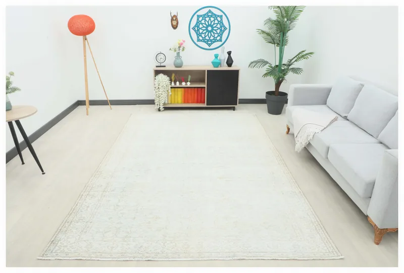 Full overhead view of the 6'7" x 9'9" cream vintage Anatolian rug on a white background.