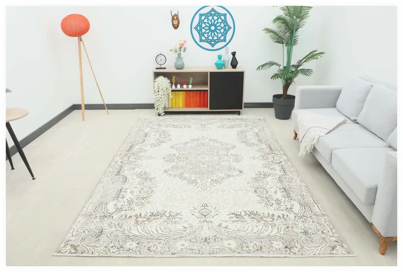 Full overhead view of the beige vintage Anatolian rug with medallion and floral patterns