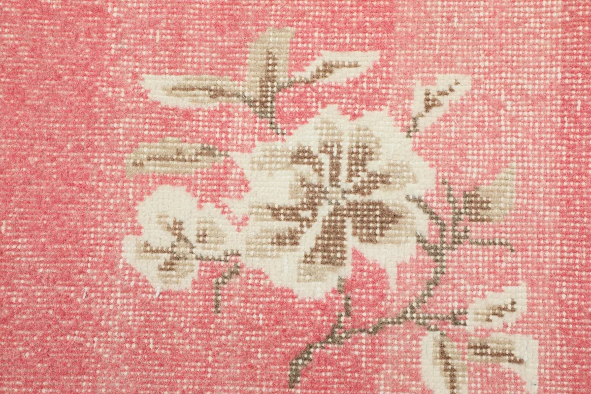Close-up of the low wool pile and the intricate floral pattern