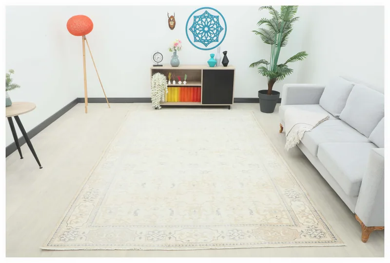 Full overhead view of the 6'10" x 9'11" cream vintage Anatolian rug on a white background.