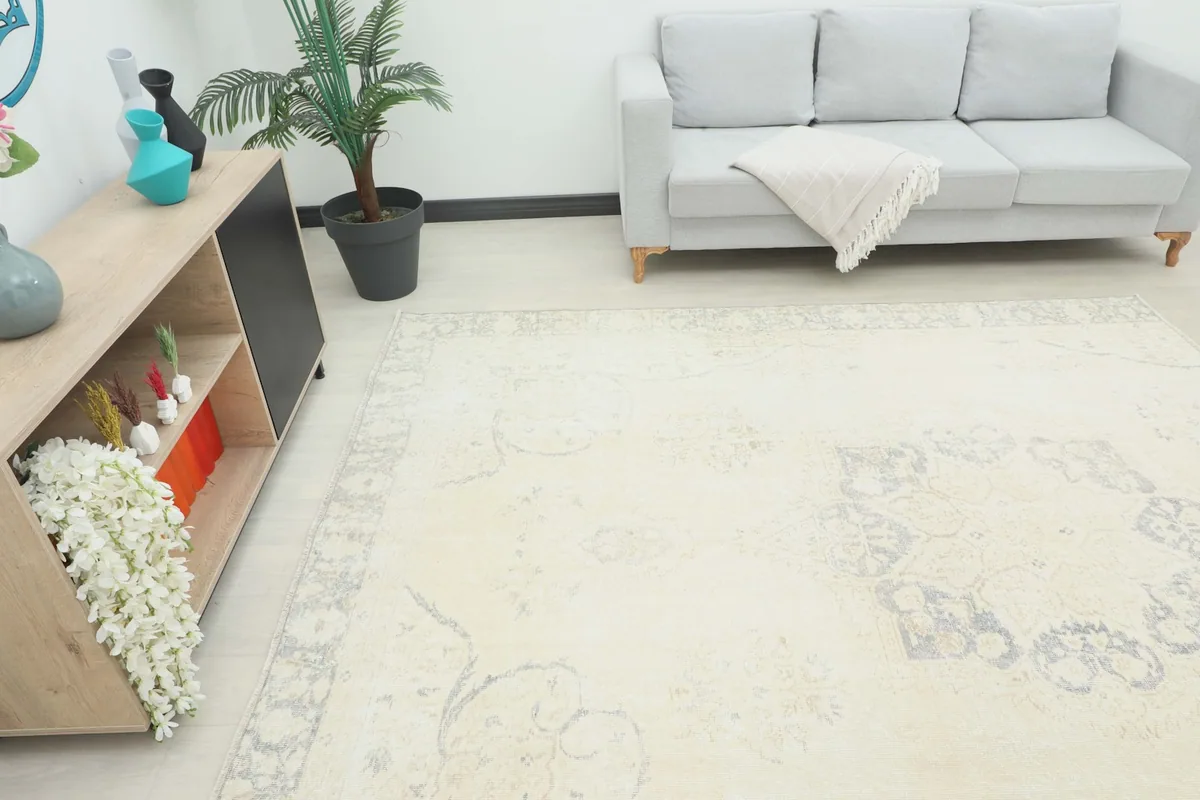 Angle view of the rug in a living room setup, showing its size relative to furniture
