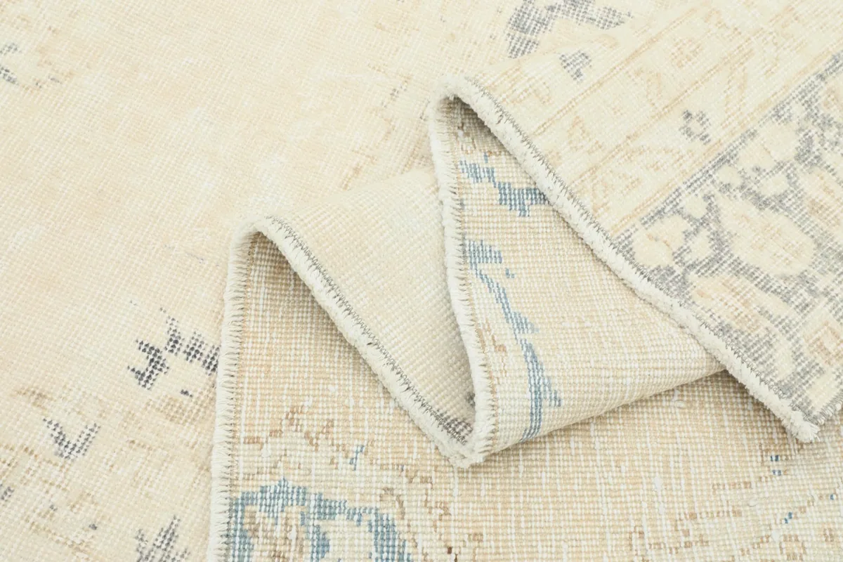 Folded rug showing the reverse side and the texture of the wool pile
