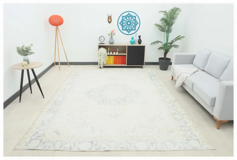 Full top view of the 7'9" x 10'8" ivory and blue vintage Anatolian area rug on a white background.