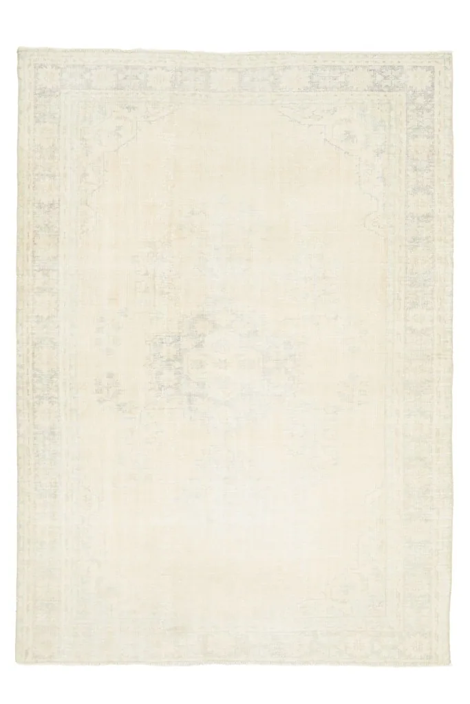 Full overhead view of the 6'10" x 9'8" vintage ivory Anatolian rug, highlighting its overall design