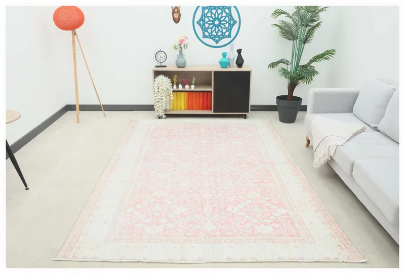 Full top view of the 6'6" x 9'3" vintage rose floral Anatolian area rug on a white background.