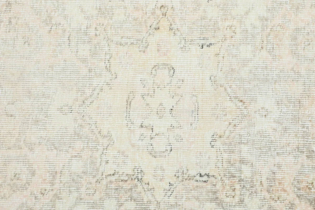Close-up of the distressed pile texture, showing the subtle color variations and hand-knotted detail.