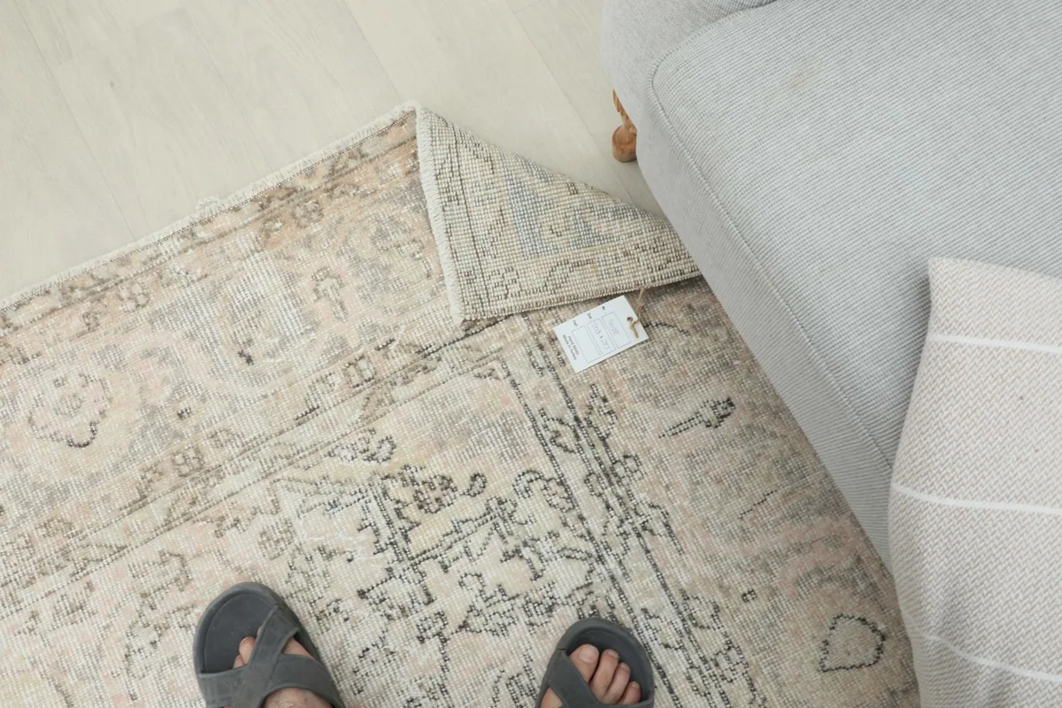 Overhead view of a person's feet on the rug, showing the rug's texture and overall feel.