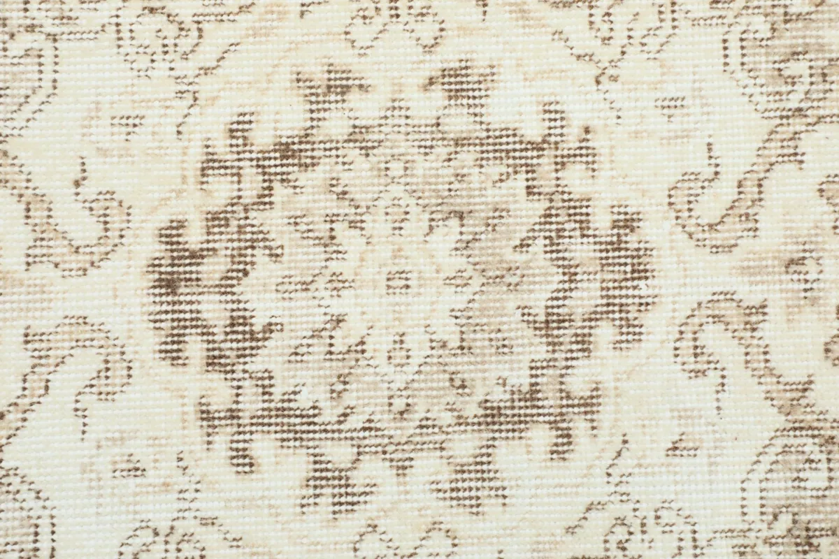 Close-up of the intricate floral and geometric motifs within the central medallion.