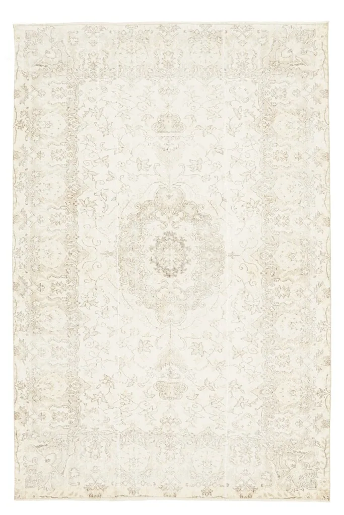 Flat overhead view of the entire ivory and beige vintage Anatolian area rug.