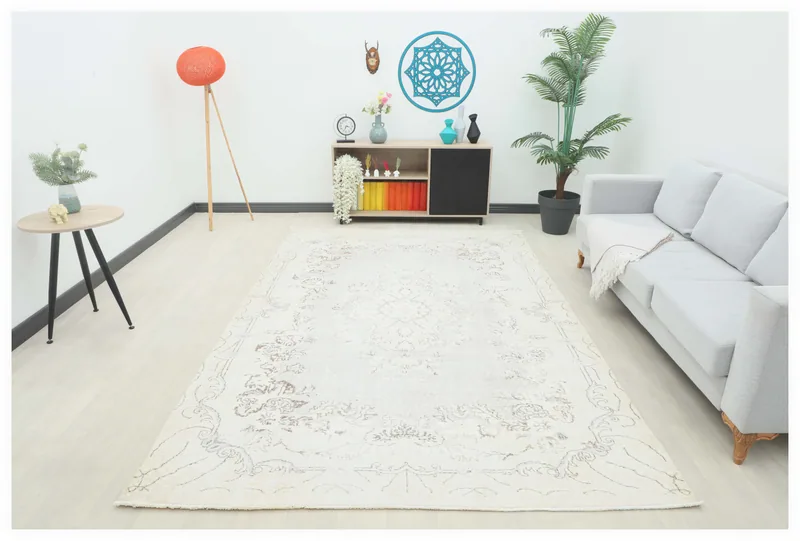Full overhead view of a 6'8" x 10'1" cream vintage Anatolian rug with medallion and floral motifs.