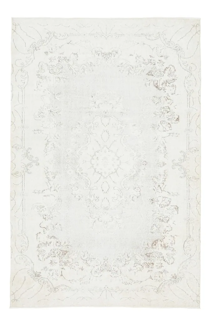 Full overhead view of the cream vintage Anatolian rug on a white background, highlighting its overall design.