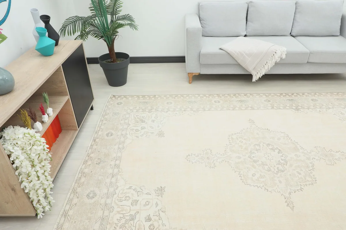 Angled view of the cream vintage rug in a living space with modern furniture