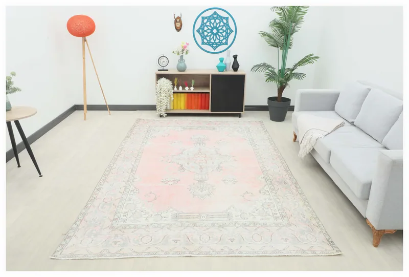 Full top view of the 6'5" x 9'10" vintage Anatolian area rug with a soft rose field and medallion design