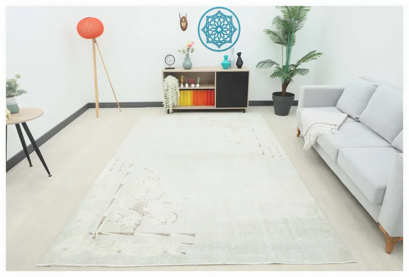 Full top view of the 6'8" x 9'9" beige distressed vintage Anatolian rug on a white background.