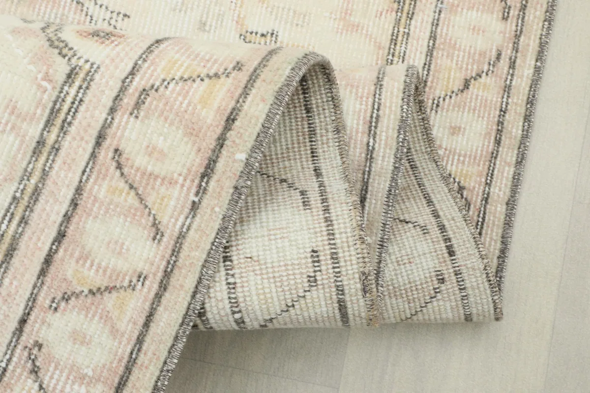 Folded section of the rug, showing the border detail and weave