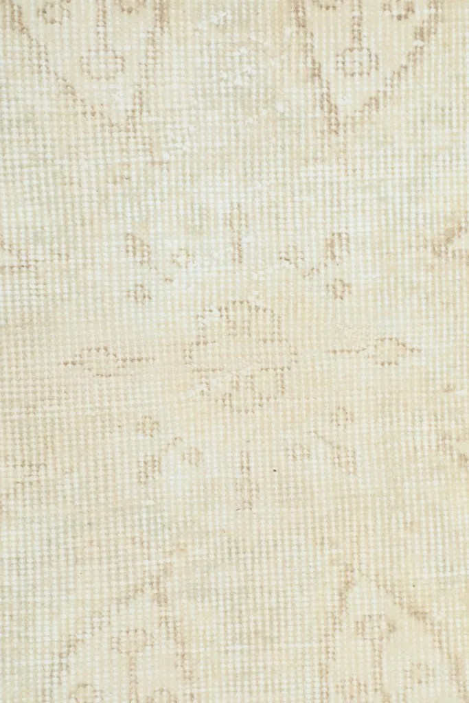 Close-up of the low wool pile and visible hand-knotted texture of the rug