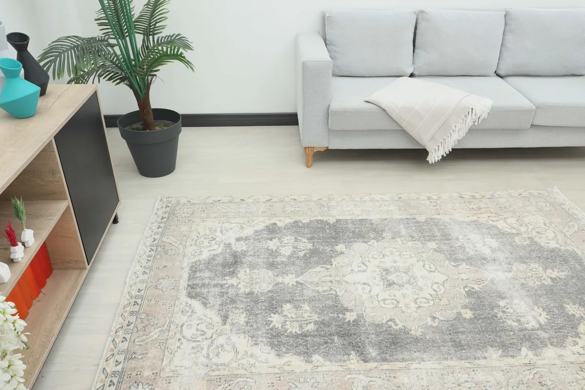 Angle view of the rug in a room, showing its placement relative to furniture