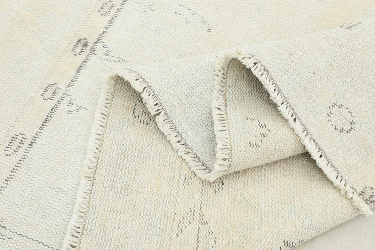 Folded section of the rug, highlighting its thickness and the texture of the low wool pile