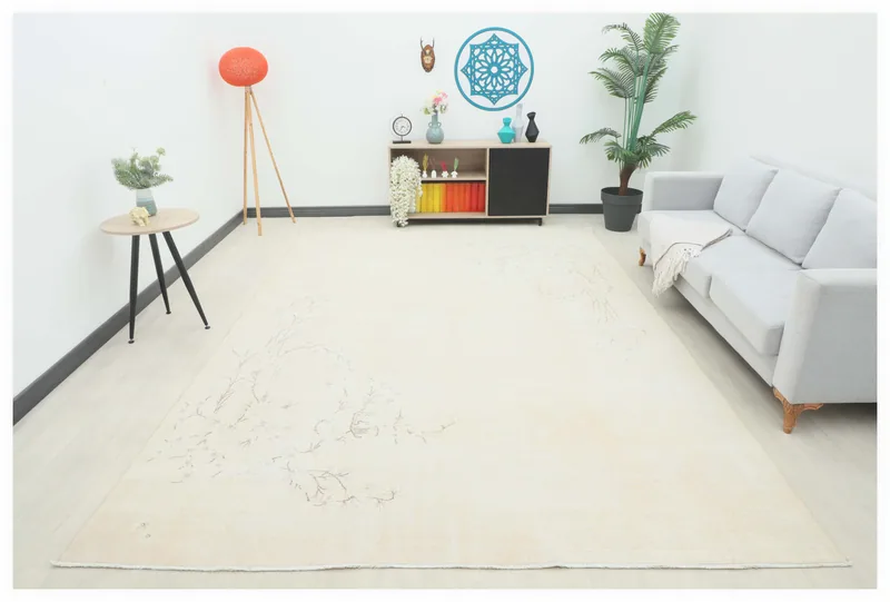 Full top view of the 8'3" x 11'9" cream and tan vintage Anatolian area rug on a white background.