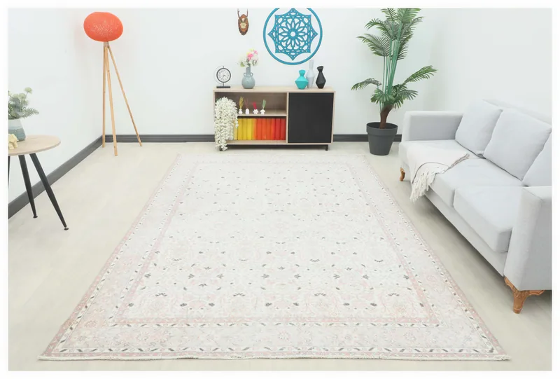 Full top view of the 7'1" x 10'4" cream and rose vintage Anatolian rug on a white background.