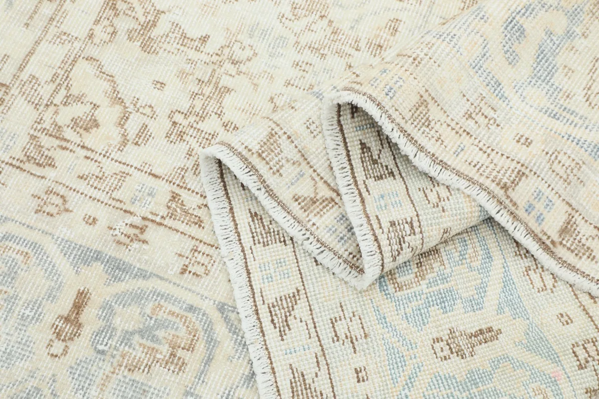 Another view of the rug folded, demonstrating its flexibility and the detail of the weave.