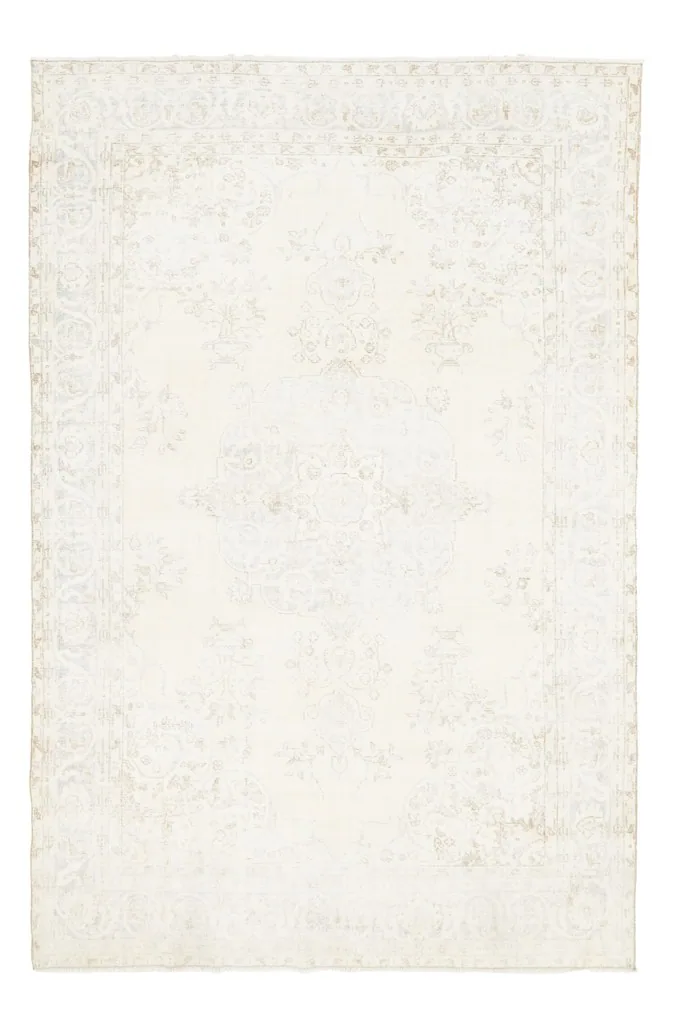 Full overhead view of the ivory, blue, and tan vintage Anatolian rug, isolated on white.